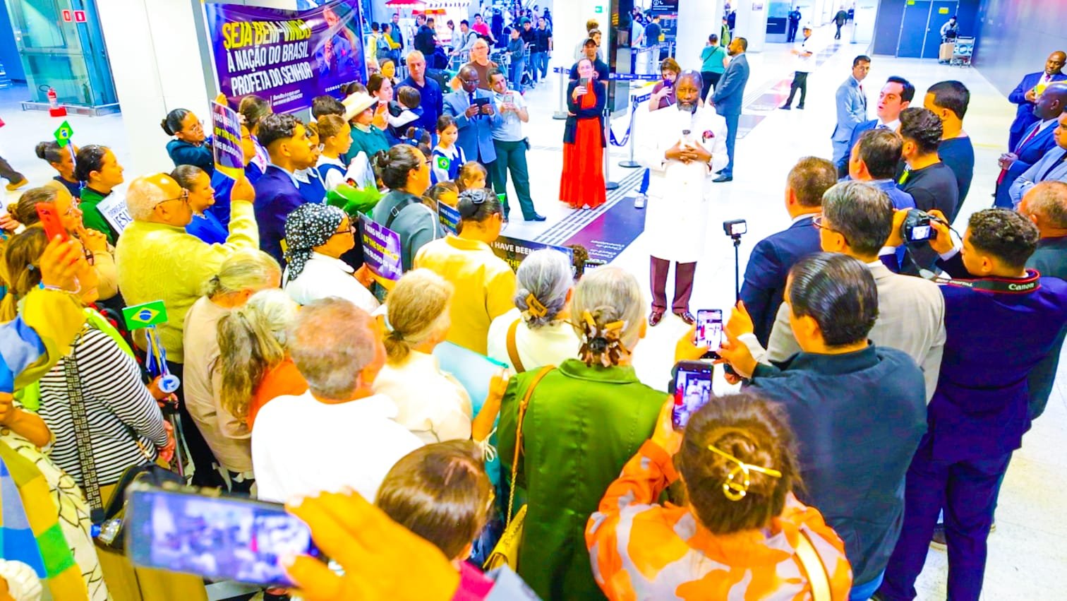 Prophet Dr. David Owuor addresses gathered believers at São Paulo airport ahead of the Brazil Revival 2026